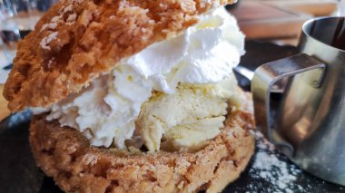 close up of a profiterole on a plate