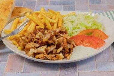 plate of kebab and fries close up