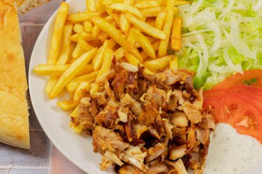 plate of kebab and fries close up