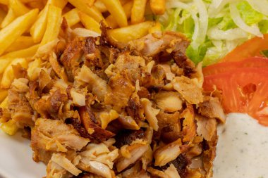plate of kebab and fries close up