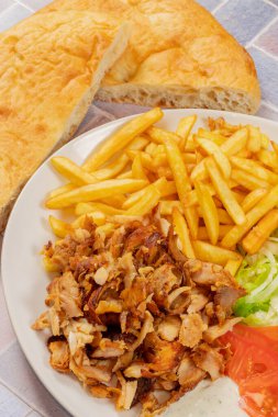 plate of kebab and fries close up
