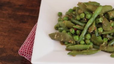 cooked green vegetables on a plate