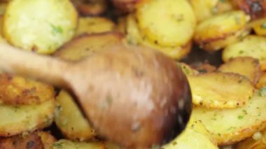 Sarladaise potatoes being cooked in a frying pan