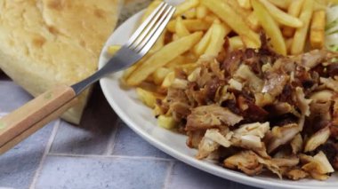 plate of kebab and fries close up