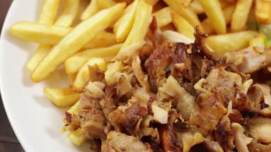 plate of kebab and fries close up