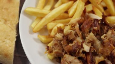 plate of kebab and fries close up