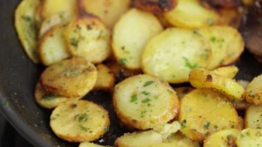 Sarladaise potatoes being cooked in a frying pan