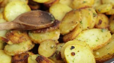 Sarladaise potatoes being cooked in a frying pan