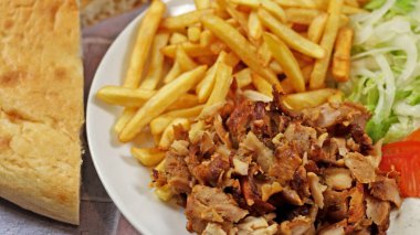 plate of kebab and fries close up