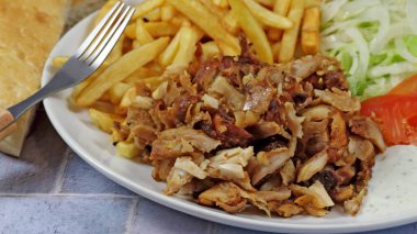 plate of kebab and fries close up