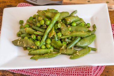 cooked green vegetables on a plate