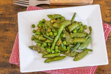 cooked green vegetables on a plate