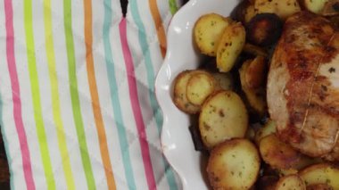 roast pork and sarladaise potatoes in a dish