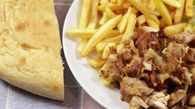 plate of kebab and fries close up