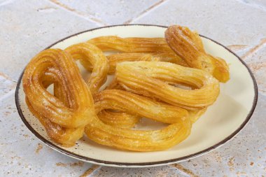 Churros close up, in a plate