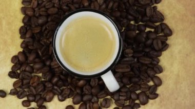 cup of coffee and coffee beans close up