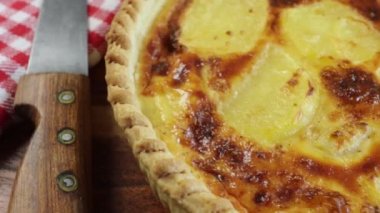 Quiche with potatoes and county, in close -up, on a table