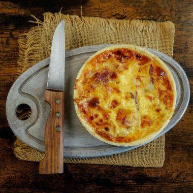 bacon and cheese pie, close-up, on a table
