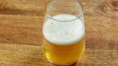 glass of soda, close-up, on a wooden table
