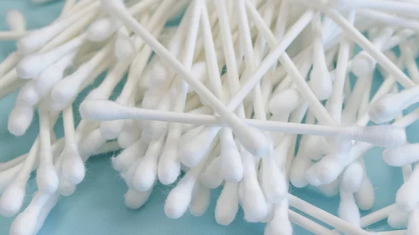cotton swabs, close-up, on a blue background