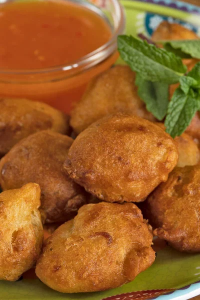 stock image Cod fritters and sauce, close-up, on a plate