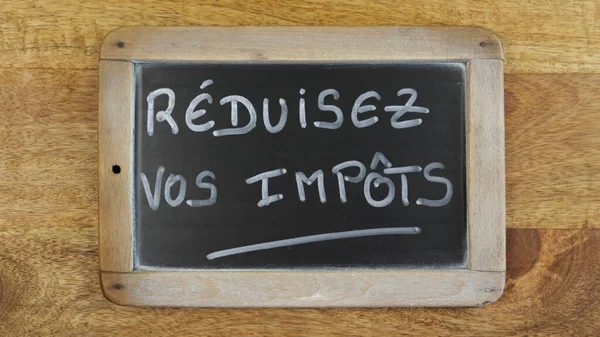 Słowa Obniżyć Podatki Napisane Francusku Tabliczce — Zdjęcie stockowe