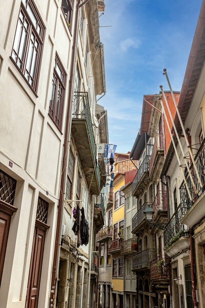 Colourful houses in a narrow street in the city of Porto (Portugal)