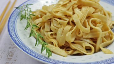 plate of stir-fried chinese noodles, close-up