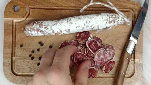 Several People Eating Slices Dry Sausage — Stock Video