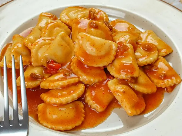 tomato ravioli, industrial product, on a plate