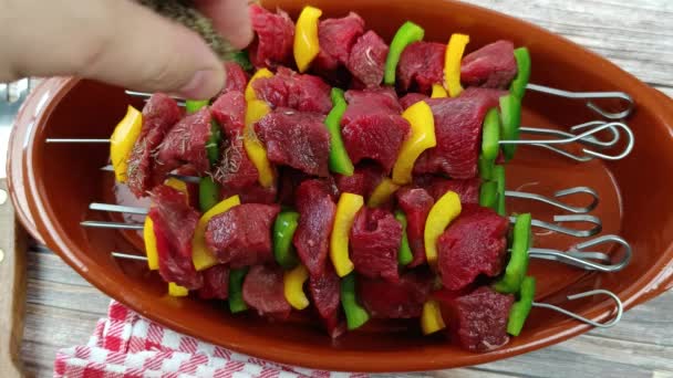 Close Man Hand Putting Herbs Pile Raw Beef Skewers — Stock Video