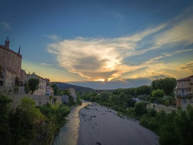 view of the Ouvze river in the evening. clipart