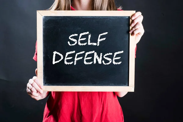 stock image woman and self defense sign, preparation against acts of violence