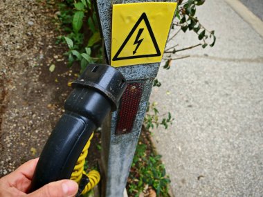 electric vehicle charging station sign, power plug and green mobility clipart