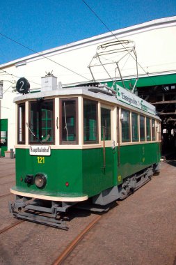 linien graz,streetcar in the city as urban public transport by rail clipart