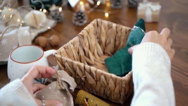 Woman Hands Wrapping Christmas Eco Gift Basket Close Unprepared Presents — Stock Video