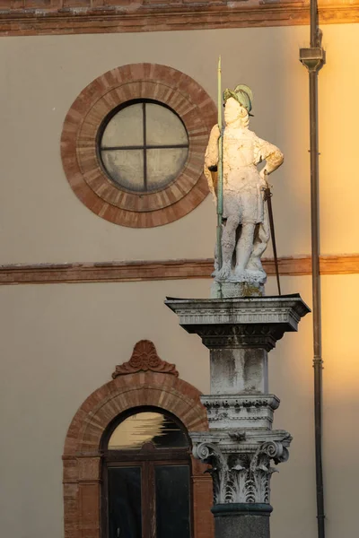 The sun illuminates the statue of Saint Vitalis ,Piazza del Popolo ,Ravenna,Italy