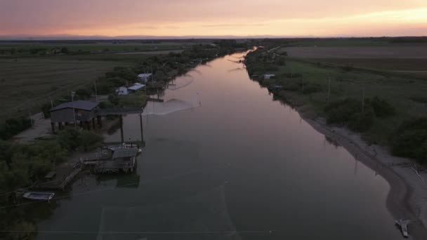 Nice Aerial View Fishing Huts Shores Estuary Sunset Italian Fishing — стоковое видео