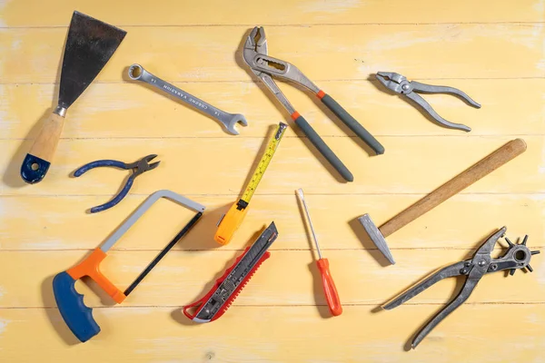 All tools supplies home construction on the yellow wooden background. Building tool repair equipments,copy space,industry engineer tool concept.still-life.