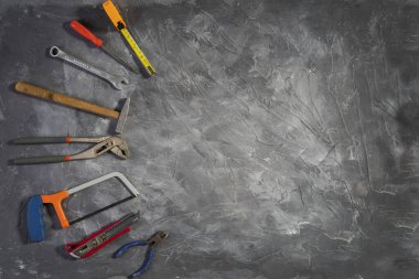 All tools supplies home construction on the gray wooden background. Building tool repair equipments,copy space,industry engineer tool concept.still-life.