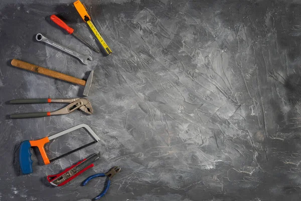 All tools supplies home construction on the gray wooden background. Building tool repair equipments,copy space,industry engineer tool concept.still-life.