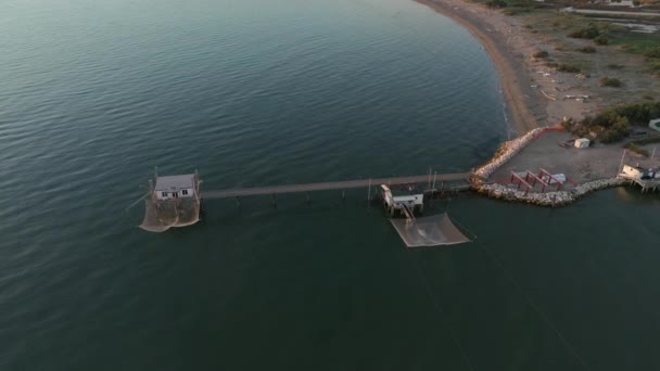 Slow Motion Aerial View Fishing Huts Shores Estuary Sunset Italian – stockvideo