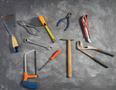 All tools supplies home construction on the gray wooden background. Building tool repair equipments,copy space,industry engineer tool concept.still-life.