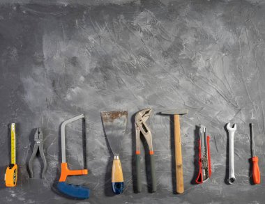 All tools supplies home construction on the gray wooden background. Building tool repair equipments,copy space,industry engineer tool concept.still-life.