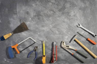 All tools supplies home construction on the gray wooden background. Building tool repair equipments,copy space,industry engineer tool concept.still-life.