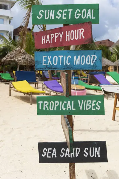 Colorful signs with the writing sun set goal,Happy hour,exotic mood,tropical vibes,sea sand sun, on sandy beach at sunny day,relax and summer concept.