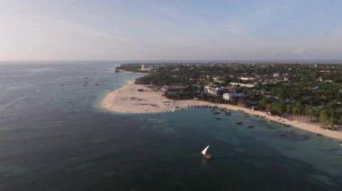 Awesome aerial shot of shoreline and ocean in zanzibar at sunny day, tanzania.Shot at 50 fps.