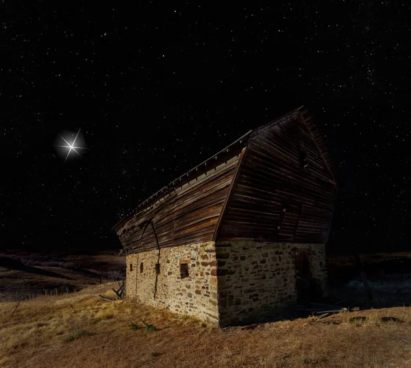 stock image Bright star on the horizon approaching an old barn