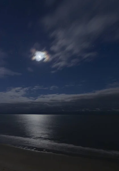 Colorful moon and clouds over the Atlantic Ocean at Myrtle Beach
