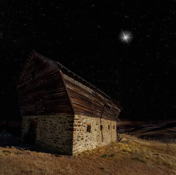 stock image Old stable on Christmas Eve with a star shining brightly above